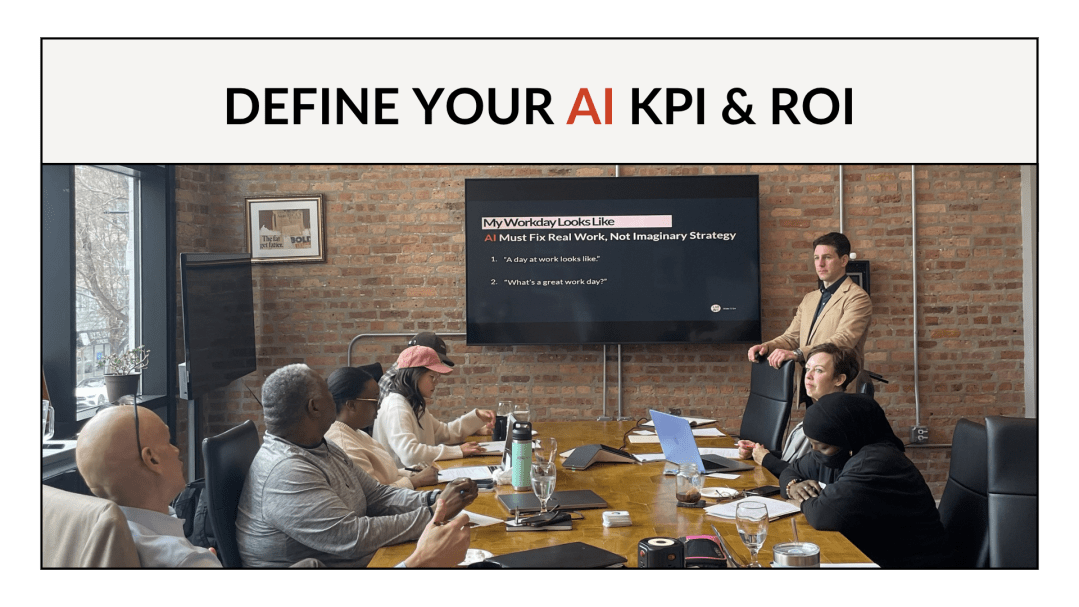 Logan Monday facilitating the Define Your AI KPI and ROI workshop at Entrenuity in Chicago, standing at the head of a conference table with participants and a workshop slide visible on screen behind him.